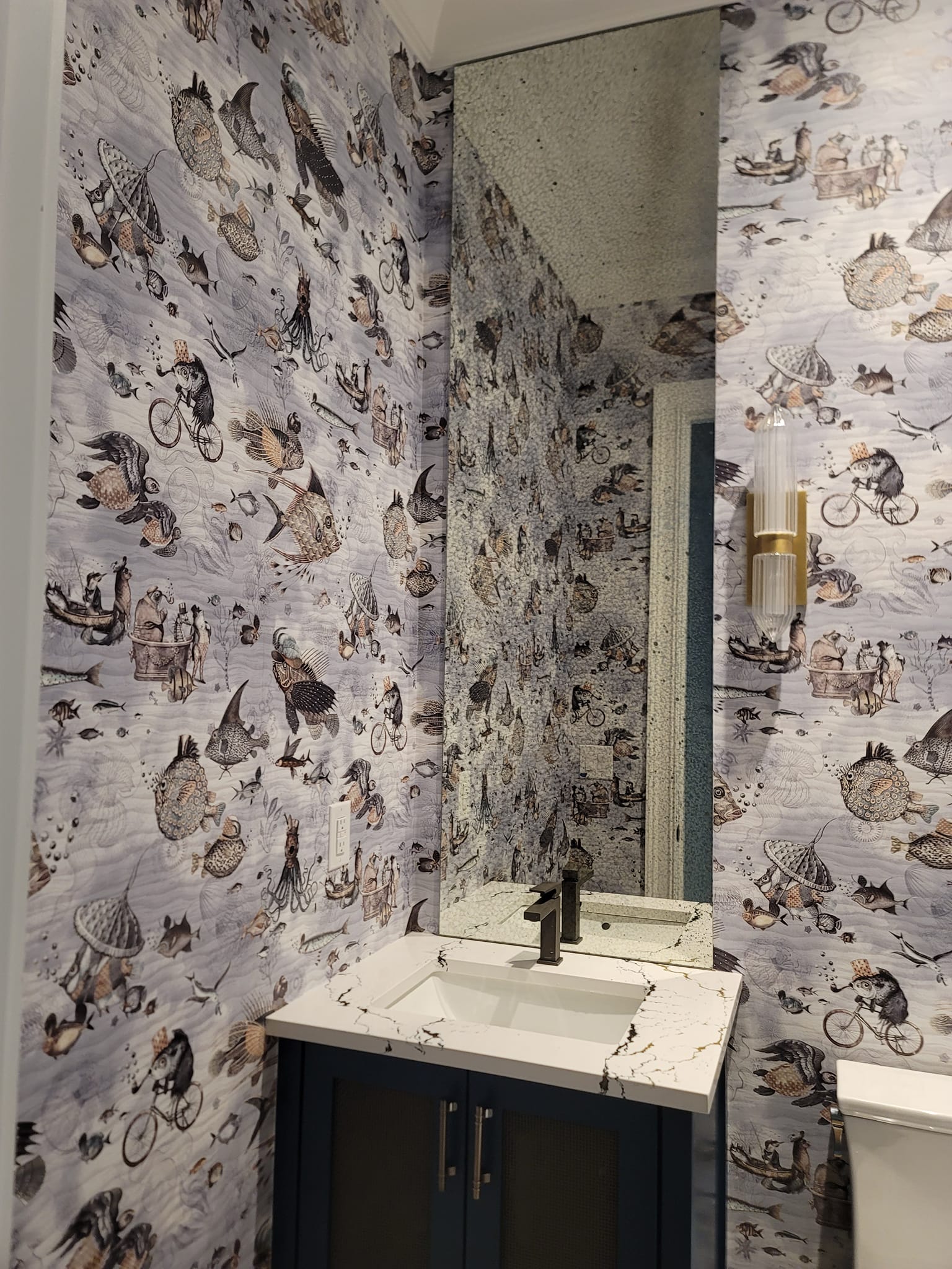 Whimsical underwater sea creature wallpaper in bathroom by Lillian's Interiors